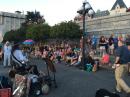Evening Crowd Listening to Street Entertainment in Victoria Harbour: Vancouver Island, British Columbia, July 2016